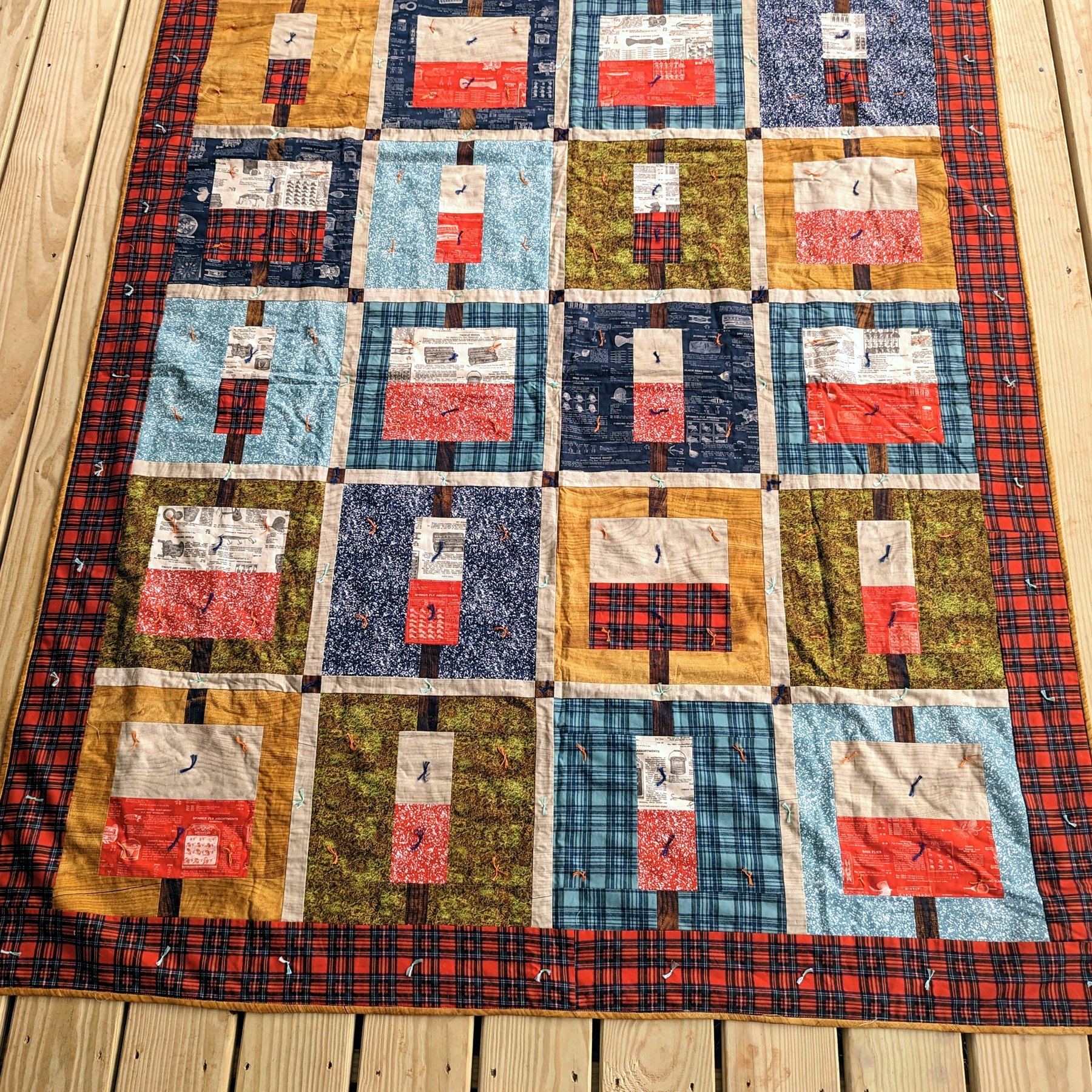 Log Cabin Quilt - Traditional log cabin blocks with red plaid border