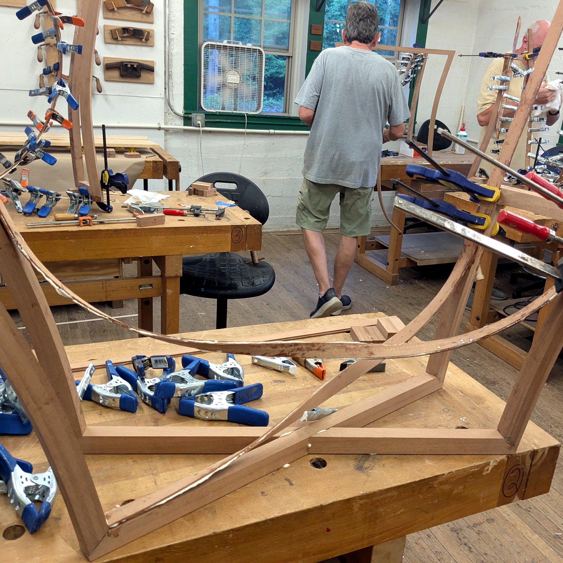 Chair Frame Assembly - Curved wood chair frame clamped during assembly