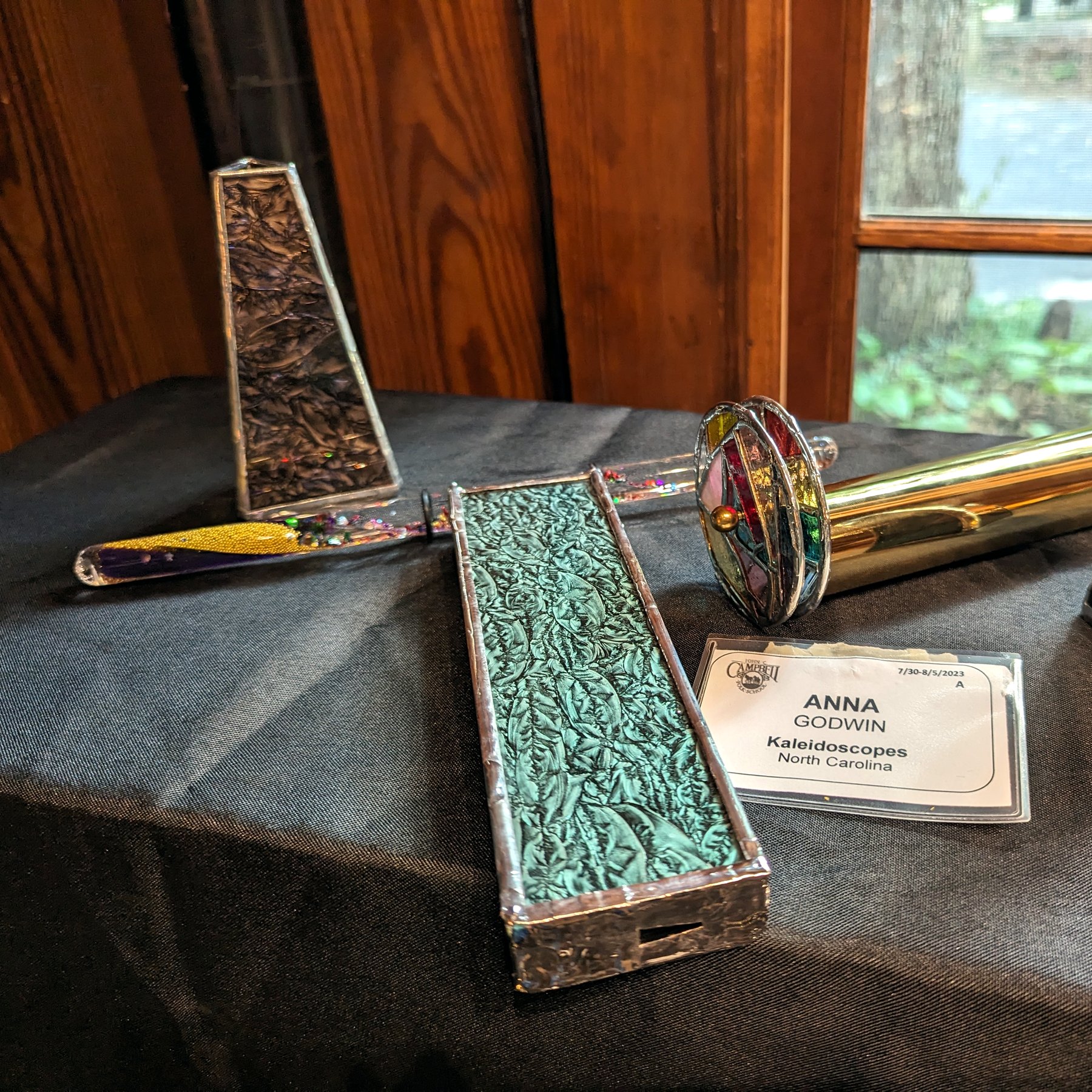 Kaleidoscope Show Display - Multiple kaleidoscope bodies on a display table at a craft show